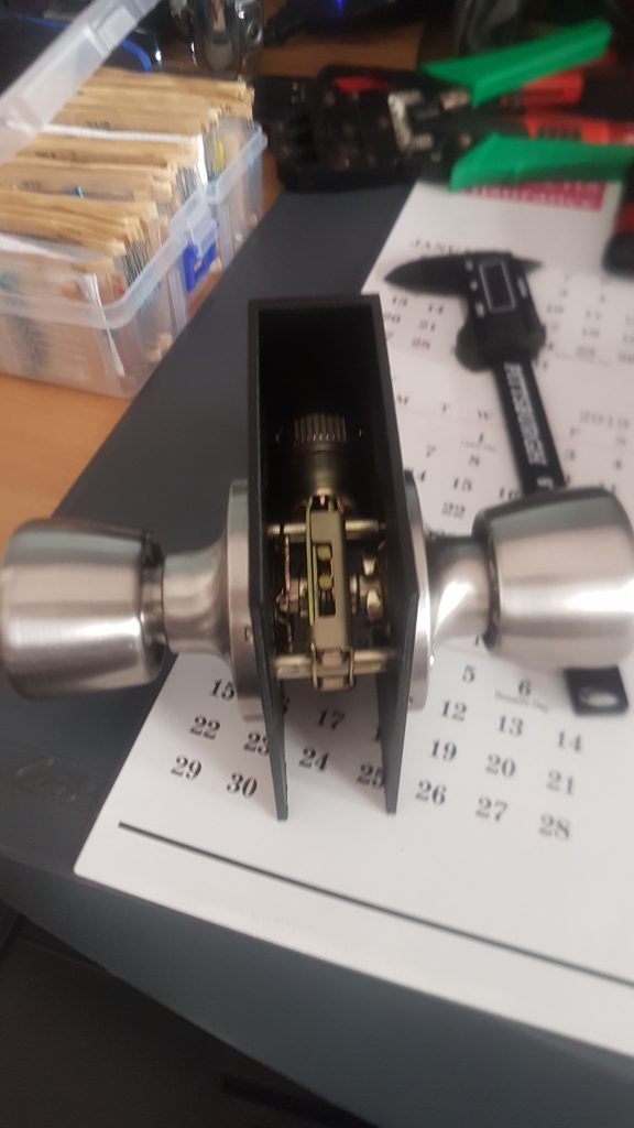Door handle with the lock mechanism exposed
