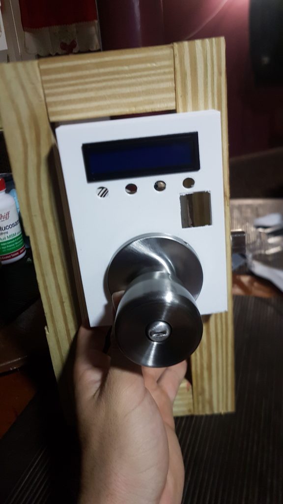 Door lock mechanism during final assembly, first view